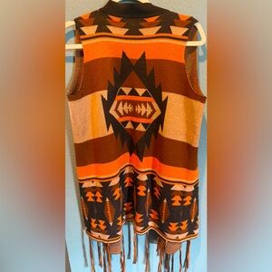 Lucky & Blessed Tan, Black, & Orange Aztec Vest with Fringe
Size: SM